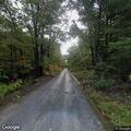 Tree blocking most of roadway on Coal Road