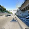 Car leaves roadway and becomes stuck under bridge