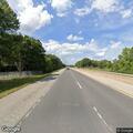 Man slumped on motorcycle checked in roadside field