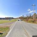Pickup truck hits trash can on Mills Gap Road