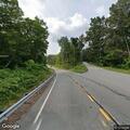 Vehicle driving in roadside swale on Route 82