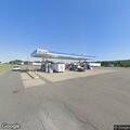 Pickup with trailer hits gas station safety barrier