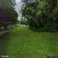 Truck reported parked on grass at city dog park