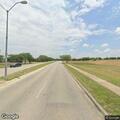 Male lying in grassy area on highway on-ramp