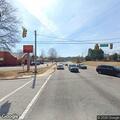 Person slumped over in vehicle at intersection