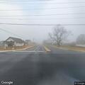 Tree blocking road at North Trade and Highway 14