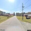 Person experiencing chest pain and breathing difficulty at home