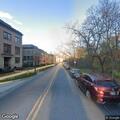 Person slumped over wheel in vehicle at Chevy Chase
