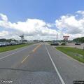 Report of person walking by highway near Sonic