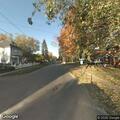 Truck hits yard wall and loses tire on South Fifth
