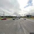 Man sitting near bus stop with leg pain on Highway 101