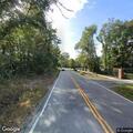 Unattended sedan with door open on Long Point Road
