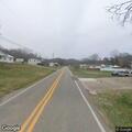 Driver crosses center line and pulls into yard