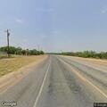Deer carcass blocking roadway on FM 496