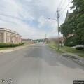 Pedestrian walking in middle of road in Herkimer