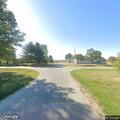 Vehicle driving on park walking path