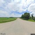 Vehicles doing donuts at rural intersection