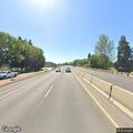 Garbage fire along I-105 stone retaining wall