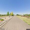 Brush and hay bale fire near outbuilding in Bennett