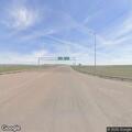 Truck and trailer take 2011 Dodge from frontage road