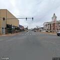 Crash involving gray truck and driver with back pain