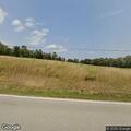 Vehicle slides off road into hay field on Route 151