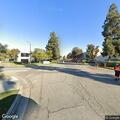 Person sick on Artesia Street near donut shop