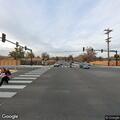 Man in wheelchair blocks road at intersection