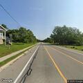 Debris removed from road near crosswalk sign