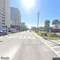Male lying on sidewalk moves near N Ocean Blvd