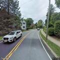 Motorcycle group surrounds house on Main Street