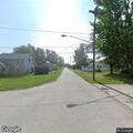 Low-hanging wire reported in alley near Maple Street