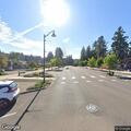 Person experiencing back pain at Dollar Street and Willamette Falls Drive