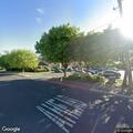 Shirtless man walking in traffic near senior park