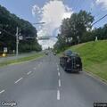 Man standing in crosswalk at Piney Branch and New Hampshire