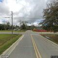 Person with flashlight at abandoned Colquitt Road home