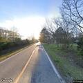 Man throwing objects into road in Sulphur Rock