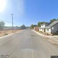 Small house fire with minor spread to vegetation