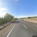 Car stopped in middle of eastbound freeway