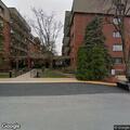 Person experiencing back pain at Acacia Circle