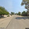 Lane closed to clear branches from spilled load