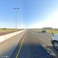 Disabled vehicle facing wrong way on I-35 shoulder