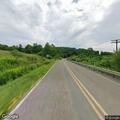 Low-hanging utility line across roadway in Rush