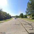 Driver reports vehicle following with bright headlights