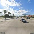 Three-car crash with smoking vehicle on boulevard