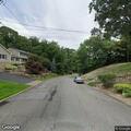 Tree blocking roadway on Beacon Hill Boulevard