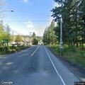 Naked man walking in roadway in Ravensdale