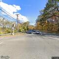 Pedestrian walking in roadway creating traffic hazard