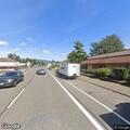 Vehicle drives through parking lot gate arm