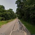 Female rider falls off moped near Green Lawn Cemetery